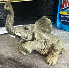 Gray Elephant Figurine, Small Sitting Elephant w/ Raised Trunk picture