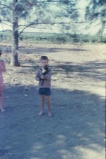 c1960's Kodachrome 35mm Slide Boy Holding Kitten Outdoors Barefoot Child Dappled picture