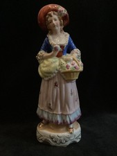 Vintage - Figurine - Japan - Colonial lady holding a basket - colorful dress picture