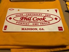 Dealership Thin Plastic License Plate Phil Cook Chevrolet Olds Madison Georgia picture