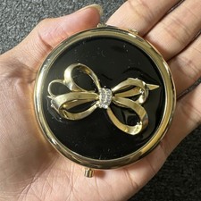 Vtg Avon Iconic Black&Gold Compact Mirror Gold Ribbon With Rhinestones  picture