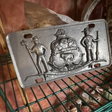 Relief Embossed Metal License Plate-Style Plaque w/ Firefighters Crest Holes picture