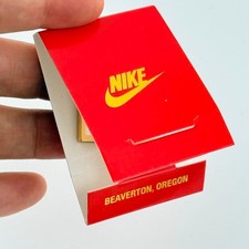 Vintage Nike Beaverton Oregon Gold Tone Swoosh Lapel Pin in Matchbook picture