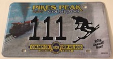 2015 Golden Pike's Peak ALPCA Souvenir License Plate 111 Train Skier Skiing picture