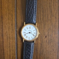 Movado Women'8747-825 Jeweled Crown Quartz Watch the glass is a little scratched picture