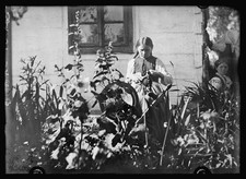 Photo:Poland 1920 Peasant Woman Spinning Rainbow Wool by Thatched Cottage picture