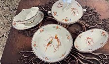 Antique Altrohlau porcelain dinnerware st with pheasant and floral motif. picture