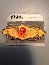 Vintage 1928 Floral Gold Tone pin in original packaging picture