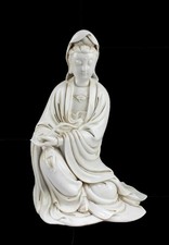 Chinese Blanc De Chine Seated Guanyin Statue. Seal mark at back of figurine picture