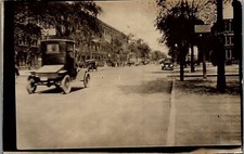 c1915 MAIN STREET VIEW PERIOD AUTOMOBILES AUTOS BUSINESSES RPPC POSTCARD 39-152 picture