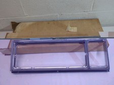 NOS 1977-1979 CADILLAC DEVILLE FLEETWOOD HEADLIGHT BEZEL GM 1610801 16029623 LH picture