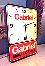 VTG. GABRIEL SHOCKS & STRATS LIGHTED ADVERTISING CLOCK & CLOCK TWO TIER DESIGN picture