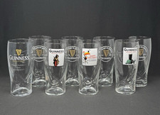 8 GUINNESS 20oz Beer Glasses Embossed Harps Lion Toucan Happy Holidays Turtle picture