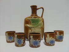 Brown Pottery Sake Alcohol Decanter With 5 Cups Woman In Hat Floral picture