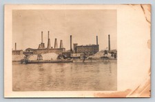 RPPC  Factory  Cranes  Piles of Salt on Ocean Front  Unknown    Postcard picture