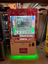 WIN BIG ARCADE MACHINE - SKILL GAME - control the pointer to push a prize picture