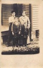 RPPC Tough Man Woman Kids Family Porch 1910s Postcard Housecoat Bricks Rustic picture