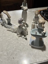 lladro figurines four in total sold together at a great price pick up only picture