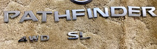 Genuine Nissan pathfinder 4WD SL Logo picture
