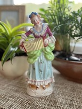 Vintage Porcelain Figurine of a Woman Playing an Accordion, Occupied Japan picture