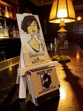 VINTAGE SNATCH A MATCH  HAS A CREASE  ADULT MATCHBOOK W/BABY DOE picture