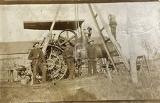 Farm Crew Hoisting a Steam Tractor With Chain Falls RPPC Photo Postcard COPY picture