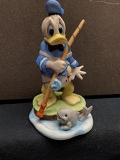 DISNEY DONALD DUCK FISHING PORCELAIN FIGURINE -MINT CONDITION -NO BOX picture