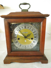 Howard Miller Mantel Clock Wood w/ Glass Door New Quartz Movement Made in USA picture