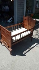Antique Rocking Crib Cradle with locking mechanism and wheels restored picture