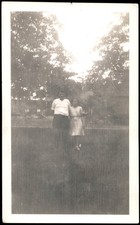 Two People Outdoors 1940s 1950s Snapshot Photograph Candid Americana Vernacular picture