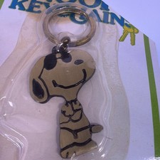 RARE SEALED Vintage Aviva Solid Brass Snoopy Keychain - 1963 picture