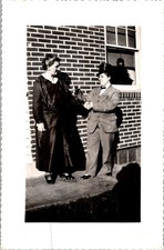 Candid Photograph of Handshake Between Women in Gender-Fluid Fashion 1940s picture