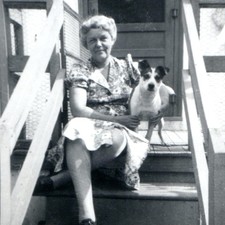 c1940s Smiling Woman Terrier Dog Porch Steps Snapshot Photo Floral Day Dress Vtg picture