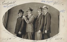 1909 Kalispell Montana Four Men Smoking Cigars RPPC Photo Postcard hats handsome picture