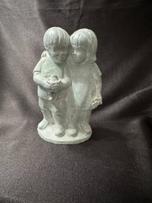 statue of a boy and girl with frog picture