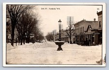 J90/ Juneau Wisconsin RPPC Postcard c1910 Oak Street Stores 196 picture