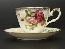 Porcelain teacup and saucer with pink rose pattern and gold trim Japan picture