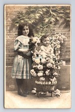 c1909 RPPC French Girl & Baby in Crib Flowers Hand Colored Real Photo Postcard picture