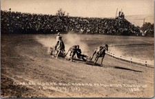1928 Pendleton Round-Up RPPC Charles Moore Bulldogging Steer Wrestling Rodeo picture