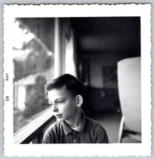 Vtg B&W Snapshot Pensive Young Boy Looking Out Window Deck Deckled Edge 1963 picture
