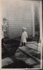 Toddler Eating Outside House Woman Watching Snapshot RPPC Photo Postcard 28A picture