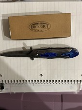 Buckshot Elegance Tactical folding knife with a blue handle. picture
