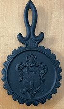 Vintage Collectible Coat of Arms Cast Iron Trivet picture