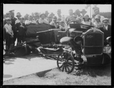 People standing around a broken car outside a Mobil oil garage - 1930s Old Photo picture