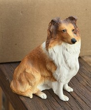 Shetland Sheepdog Hand Painted Polystone Figurine sitting 4 1/2” picture