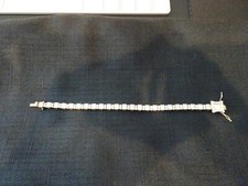 #433--STERLING SILVER TENNIS BRACELET-925- LOADED WITH STONES-GOLD COLOR picture
