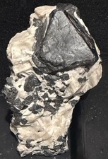 Franklinite crystal in Fluorescent Red Calcite with Willemite From Franklin,Nj picture