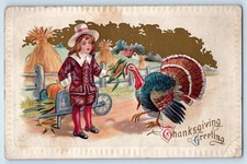 c1910's Thanksgiving Greetings Boy Feed Turkey Embossed Kenton Ohio OH Postcard picture