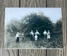 Vintage Black And White 7 People In Flower Greenery Field Photo Reprint 6 5/8” picture