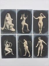 Six antique postcards featuring a lady in a